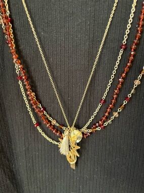 Gold Layered Necklace with Garnet-Red Beads and Charms